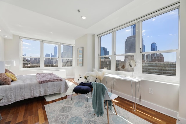 bedroom featuring hardwood / wood-style floors and lofted ceiling