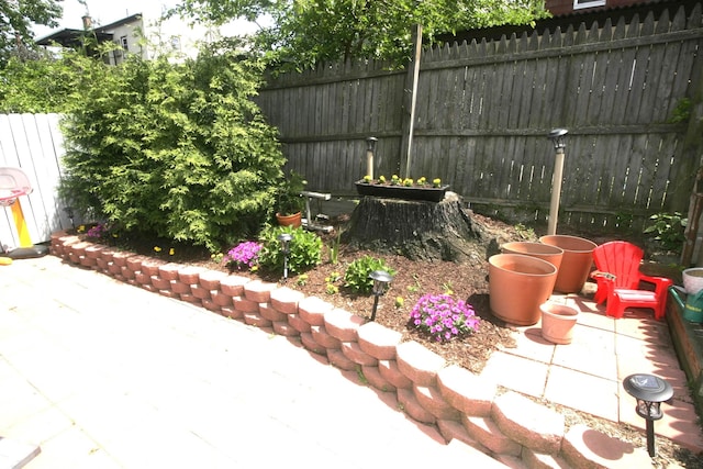 fenced backyard with a patio