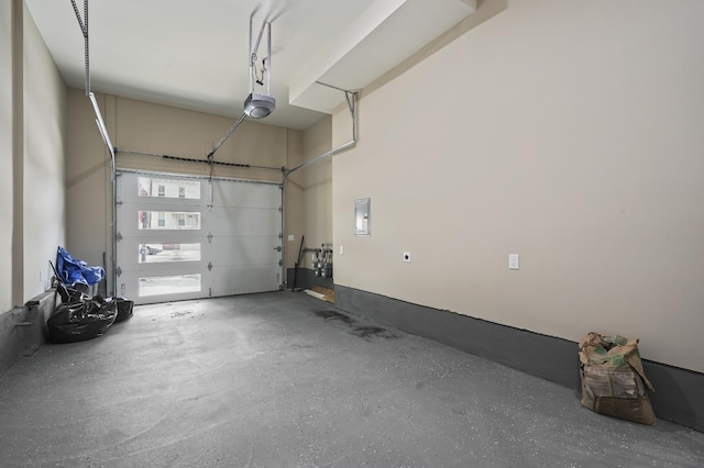 garage with electric panel and a garage door opener