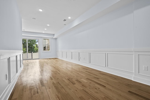 unfurnished living room with light hardwood / wood-style flooring