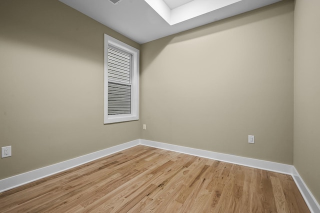 empty room with light hardwood / wood-style floors