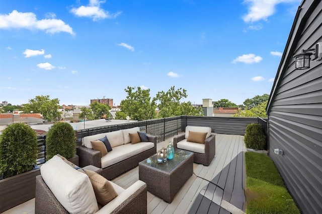 wooden terrace with an outdoor hangout area