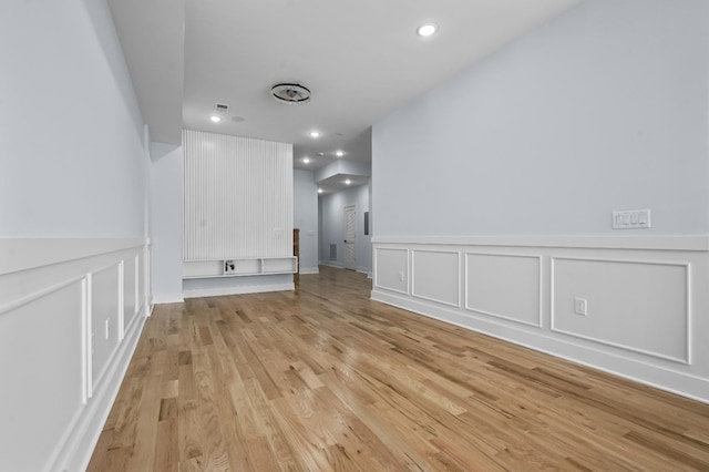 unfurnished room with light hardwood / wood-style flooring