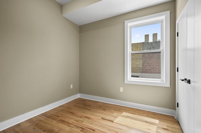 spare room featuring light hardwood / wood-style floors