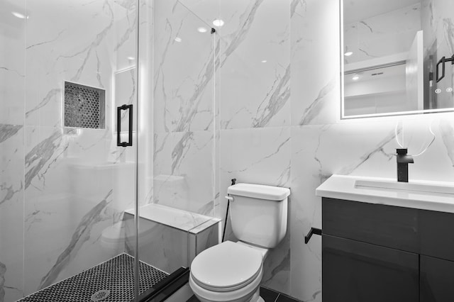 bathroom featuring toilet, vanity, and an enclosed shower