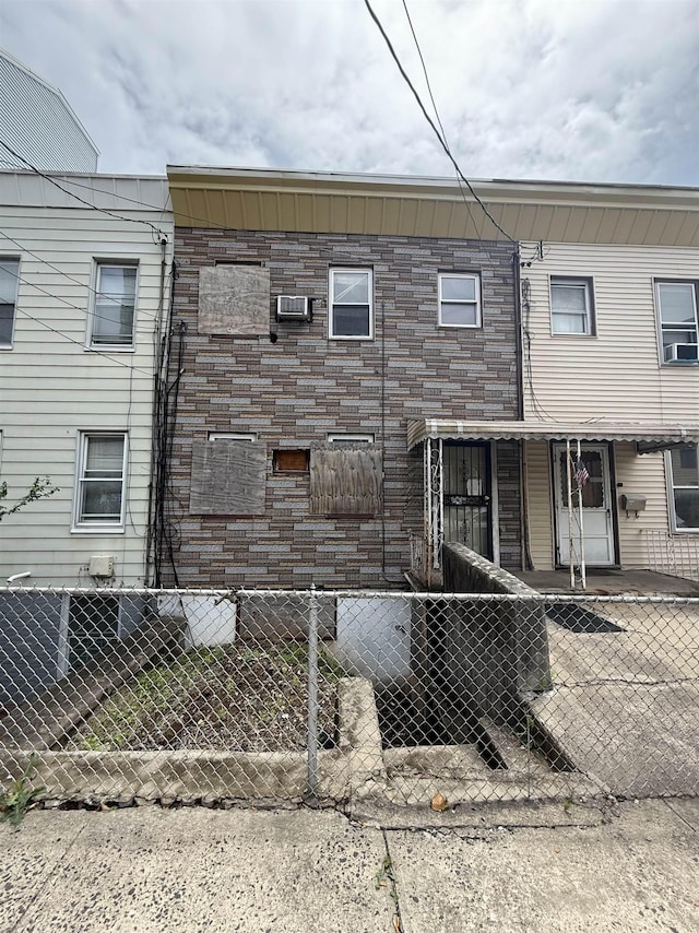 18 Perrine Ave, Jersey City, NJ 07306 - view of home's exterior featuring a fenced front yard