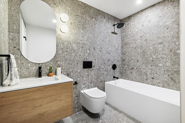 full bathroom featuring  shower combination, vanity, tile walls, and toilet