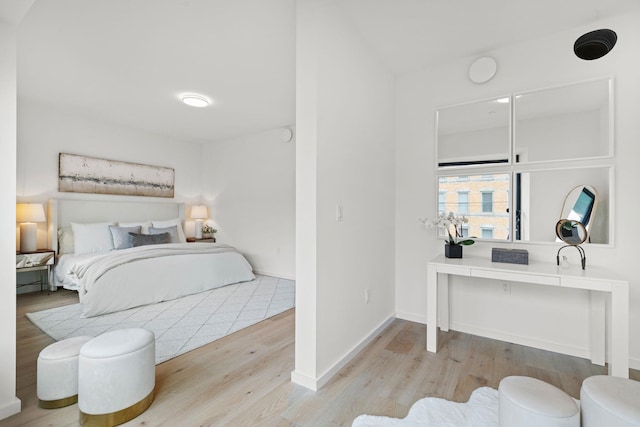 bedroom with light hardwood / wood-style floors