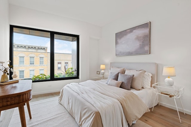 bedroom with light wood-type flooring