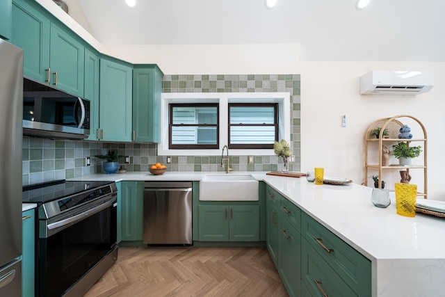 247 Harrison Ave Unit 2, Jersey City, NJ 07304 - kitchen with appliances with stainless steel finishes, a wall unit AC, a peninsula, a sink, and green cabinets