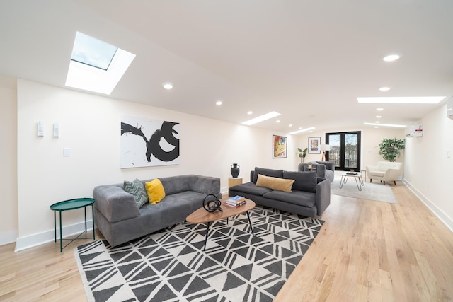 247 Harrison Ave Unit 2, Jersey City, NJ 07304 - living room featuring a skylight, light wood finished floors, recessed lighting, lofted ceiling, and baseboards
