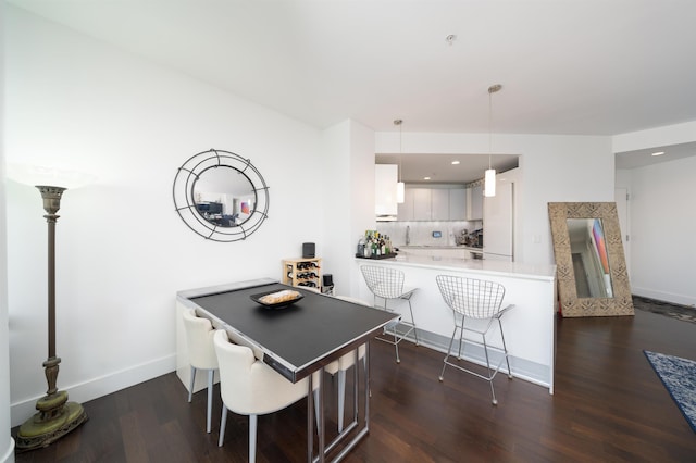 dining space featuring dark hardwood / wood-style flooring