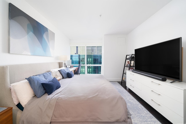 bedroom featuring dark hardwood / wood-style floors