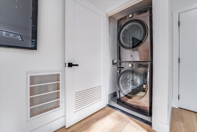 177 Wilkinson Ave Unit 1, Jersey City, NJ 07305 - laundry area with laundry area, wood finished floors, and stacked washer / drying machine