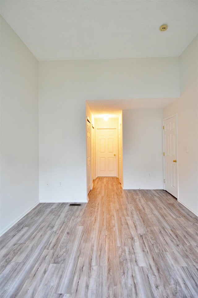 111 Watson Ct, Howell Township, NJ 07731 - spare room with light wood-style flooring, a smoke detector, and baseboards