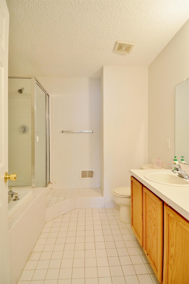 111 Watson Ct, Howell Township, NJ 07731 - bathroom featuring a shower stall, a textured ceiling, vanity, tile patterned flooring, and toilet