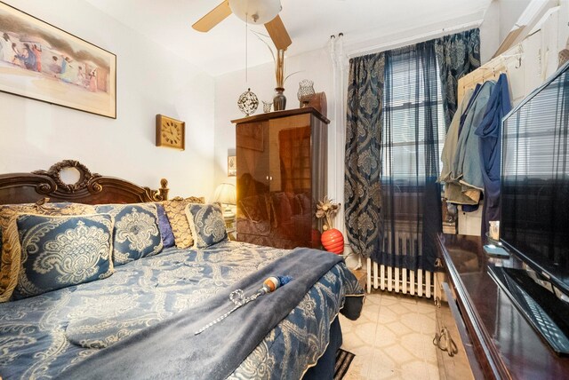 57 Wegman Pkwy, Jersey City, NJ 07305 - bedroom with tile patterned floors and a ceiling fan