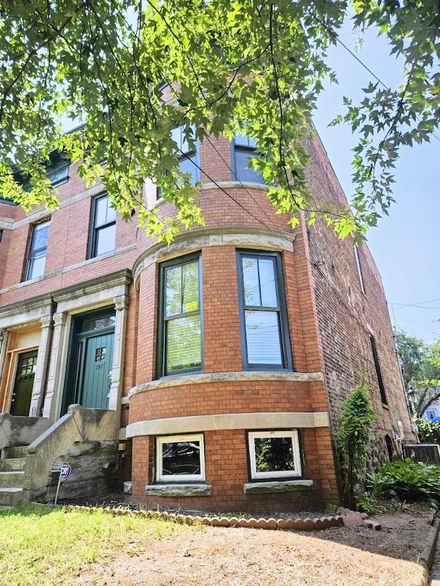 view of front of house featuring brick siding