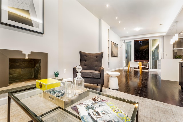living room featuring baseboards and wood finished floors