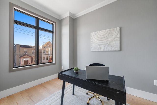 office area with baseboards, ornamental molding, and wood finished floors