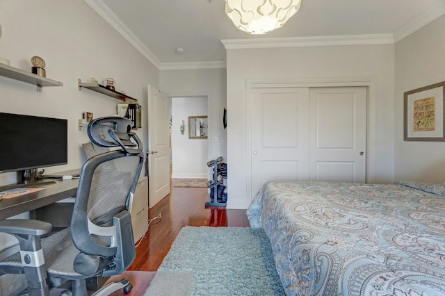 20 Avenue At Port Imperial Unit 425, West New York, NJ 07093 - bedroom featuring ornamental molding, a closet, dark wood-style floors, a desk, and a chandelier