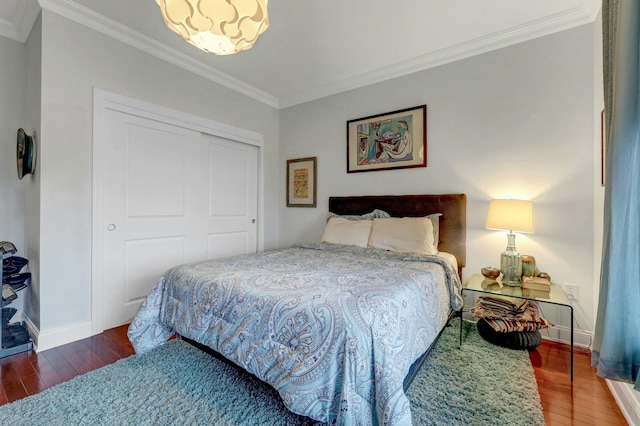 20 Avenue At Port Imperial Unit 425, West New York, NJ 07093 - bedroom featuring crown molding, wood finished floors, a closet, and a chandelier