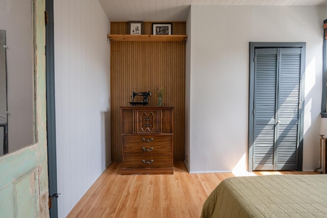 306 Sip Ave, Jersey City, NJ 07306 - bedroom with wood finished floors, a closet, and wooden walls