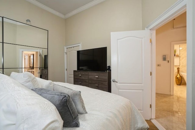 bedroom with crown molding and baseboards