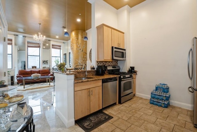 kitchen with stainless steel appliances, light brown cabinetry, a sink, dark stone counters, and crown molding