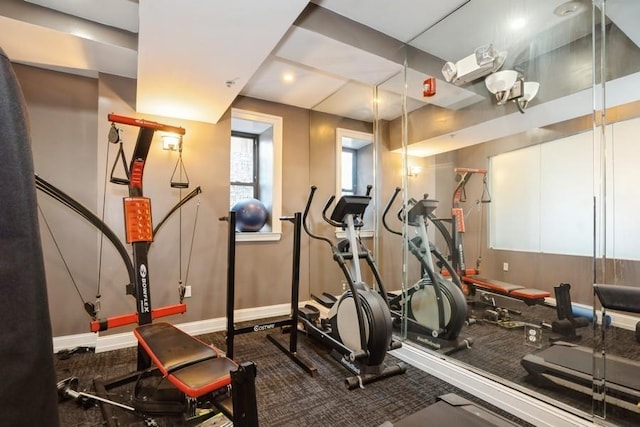 gym featuring baseboards