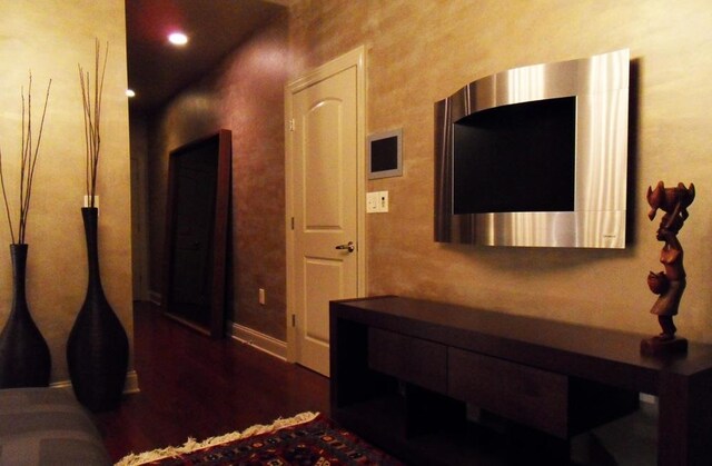 corridor featuring dark hardwood / wood-style flooring