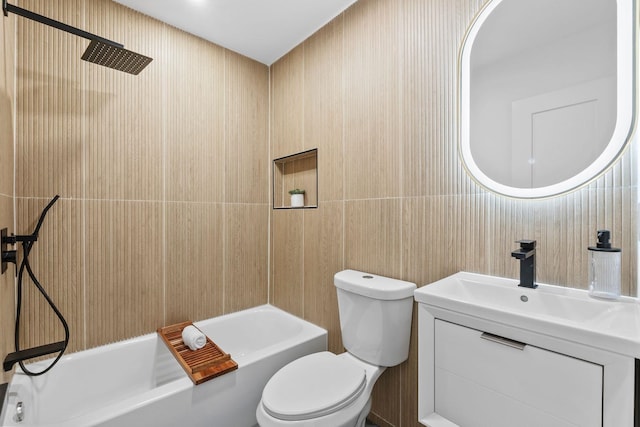 63 Jefferson Ave Unit 2, Jersey City, NJ 07307 - bathroom featuring toilet, tile walls, vanity, and tub / shower combination