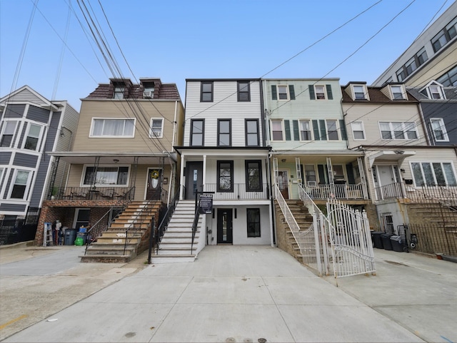 63 Jefferson Ave Unit 2, Jersey City, NJ 07307 - townhome / multi-family property with stairway and covered porch