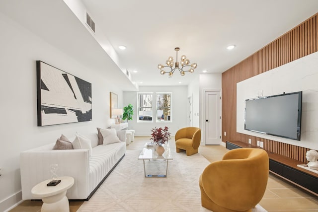 living room with recessed lighting, visible vents, baseboards, and a notable chandelier