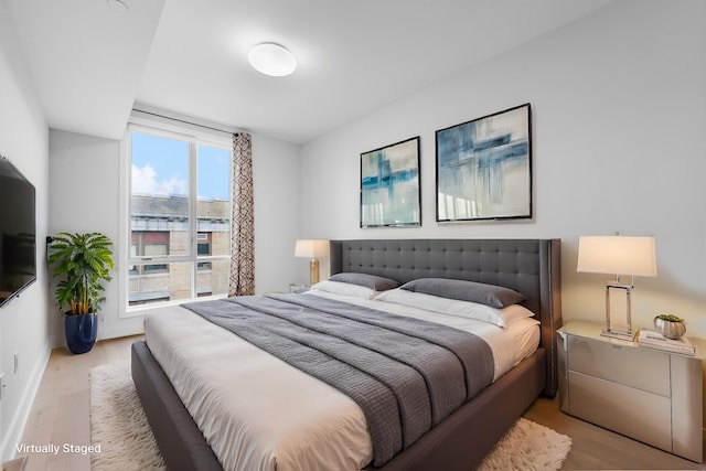 bedroom with light wood-style floors