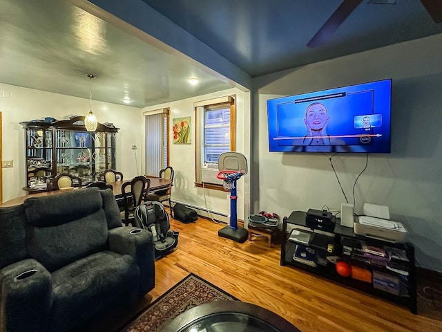 living room with hardwood / wood-style floors and baseboard heating