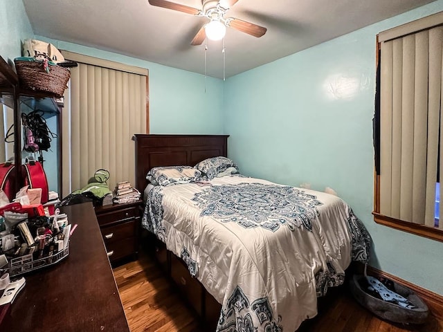 bedroom with ceiling fan and wood-type flooring