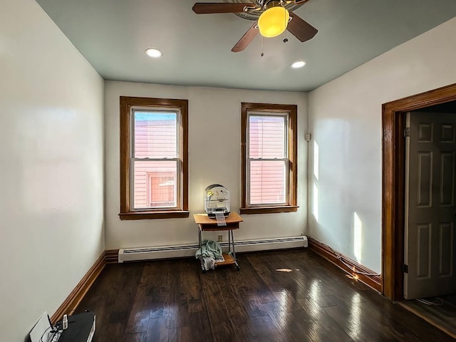 unfurnished room with dark hardwood / wood-style flooring, ceiling fan, and a healthy amount of sunlight