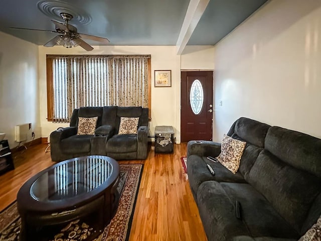 living room with hardwood / wood-style floors and ceiling fan