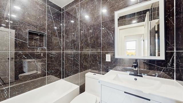 full bathroom featuring tile walls, bathing tub / shower combination, backsplash, toilet, and vanity