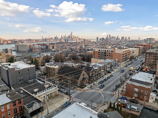 birds eye view of property with a view of city