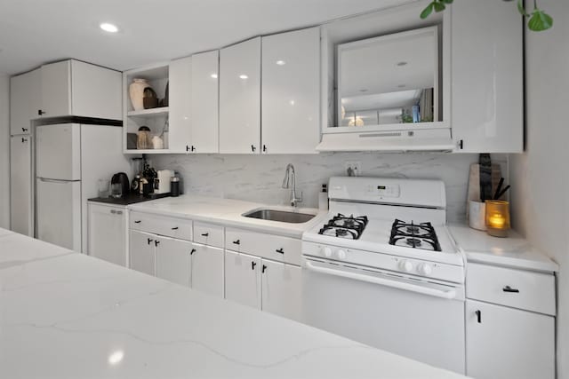 kitchen featuring open shelves, white appliances, under cabinet range hood, white cabinets, and a sink