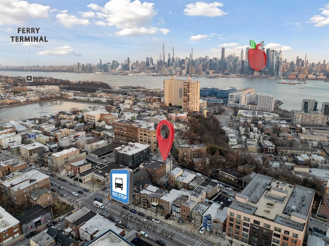 bird's eye view featuring a water view and a city view