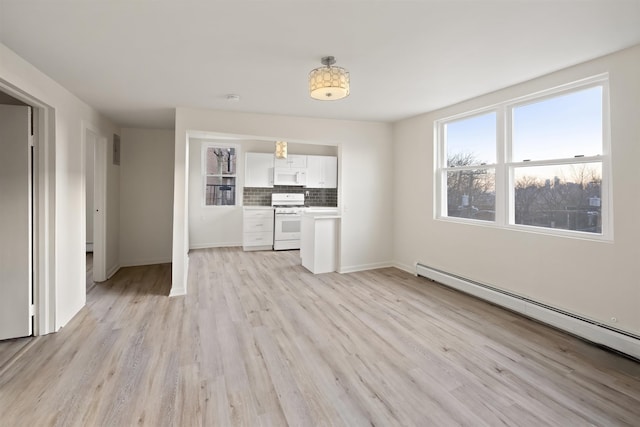 unfurnished living room with baseboards, a baseboard radiator, and light wood-style flooring