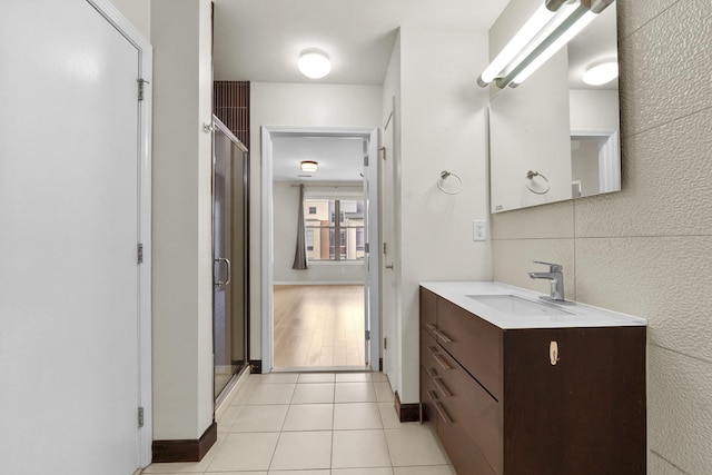 26 Ave At Port Imperial Unit 440, West New York, NJ 07093 - bathroom with vanity, tile patterned floors, and a shower with shower door
