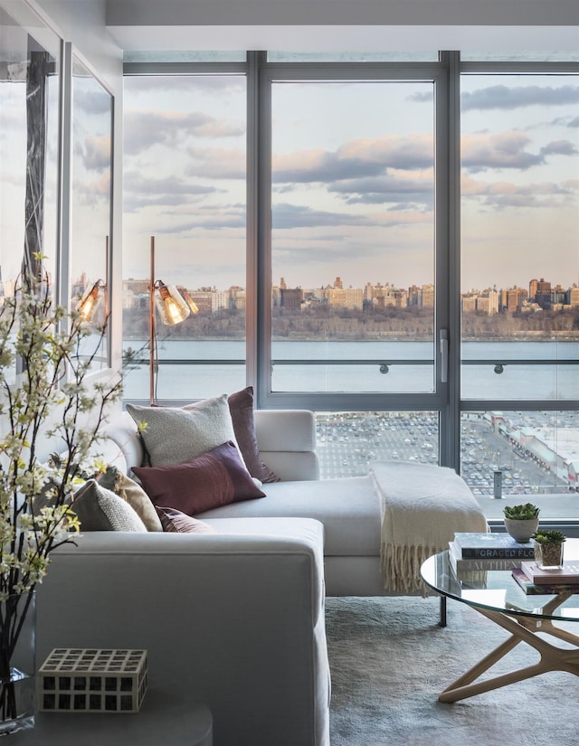 living room with a view of city and a water view