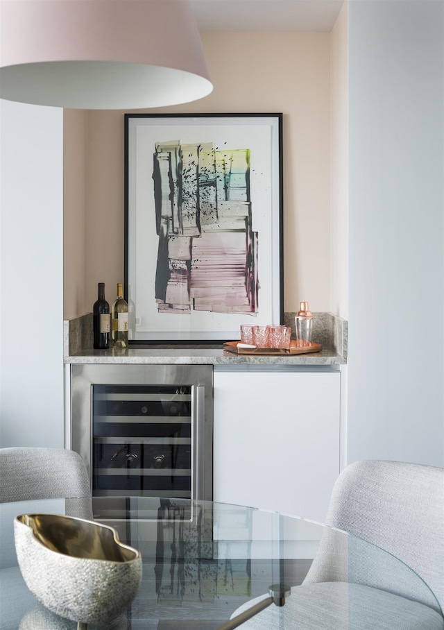 bar with beverage cooler and a dry bar