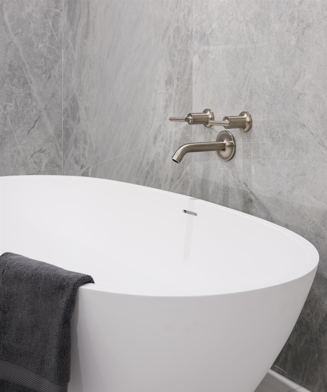 interior details featuring a freestanding bath