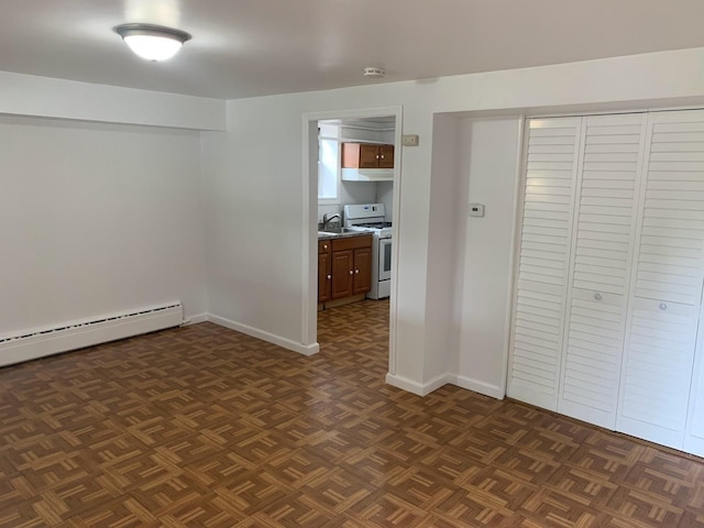 1518 38th St, North Bergen, NJ 07047 - unfurnished bedroom with a baseboard radiator, a sink, baseboards, and a closet