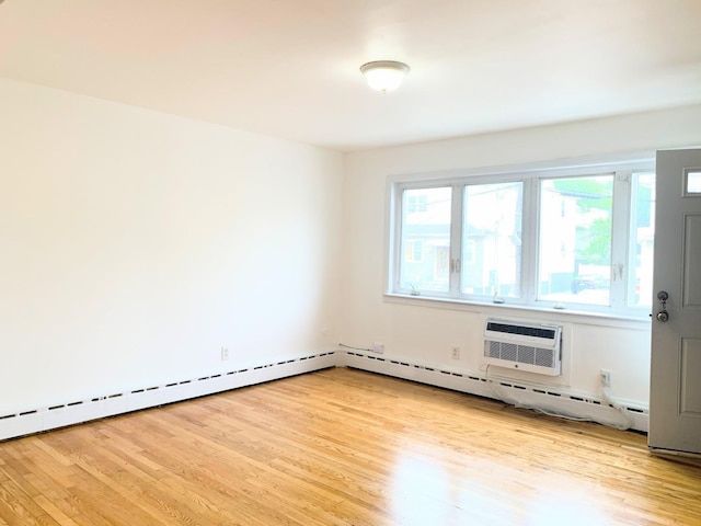 1518 38th St, North Bergen, NJ 07047 - unfurnished room featuring light wood-style flooring and a wall unit AC